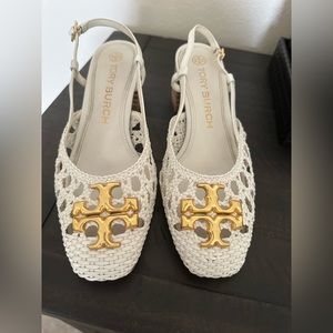 White Tory Burch Sandals with gold medallion.